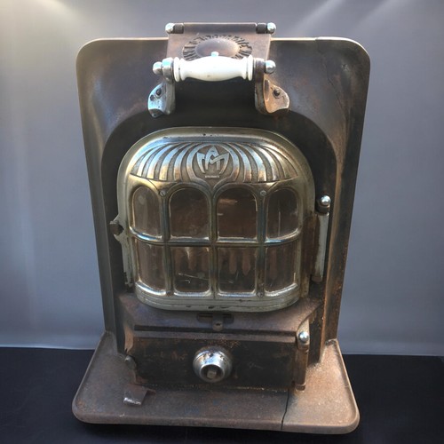 422 - Vintage French Arthur Martin Radiant Cast Iron Wood Burning Stove. Chrome and Ceramic detail. H 67cm... 