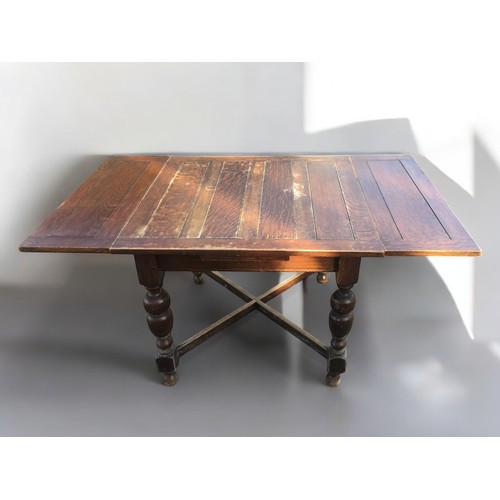 406 - 1930's/40's Oak Extending Dinning Table Having $ Baluster Legs and Cross Stretcher support.H 74cm x ... 