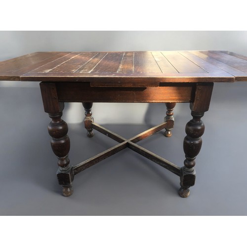 406 - 1930's/40's Oak Extending Dinning Table Having $ Baluster Legs and Cross Stretcher support.H 74cm x ... 