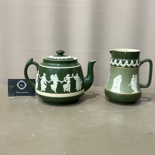 99 - Antique Green Jasperware carltonware teapot and jug set, featuring classical relief design. Marked 