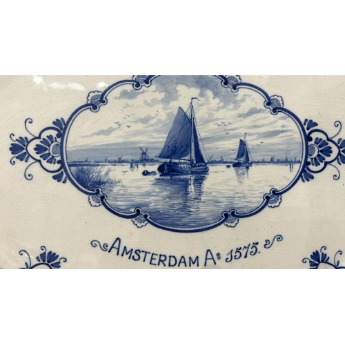 103 - China platter, featuring a blue-painted Amsterdam scene, signed Delft at base. From the 20th century... 