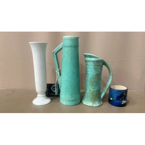 104 - Vintage Turquoise ceramic pitchers, featuring an Art Deco style with sleek geometric handles. From t... 