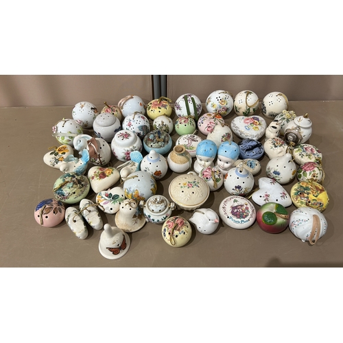 105 - A Large Porcelain pomander collection features various floral and figural designs with Taylor of Lon... 