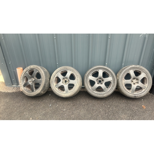 128 - a set of 4 black 17 inch alloy wheels with good tyres. tyre size 225/45R17