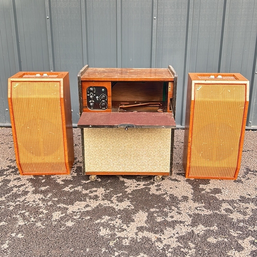 181 - Vintage wooden radiogram unit, featuring mid-century design elements. It includes a central unit wit... 