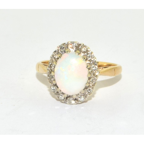 350 - Natural Opal and Diamond cluster ring in 9ct gold 3.3grms 