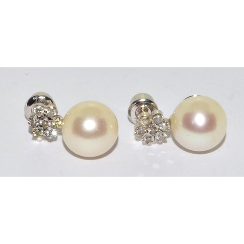 390 - Pair 18ct white gold Diamond cluster and a large natural cultured Pearl earrings 