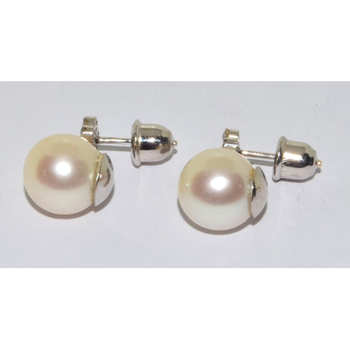 390 - Pair 18ct white gold Diamond cluster and a large natural cultured Pearl earrings 