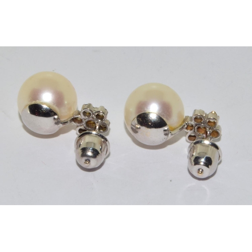 390 - Pair 18ct white gold Diamond cluster and a large natural cultured Pearl earrings 