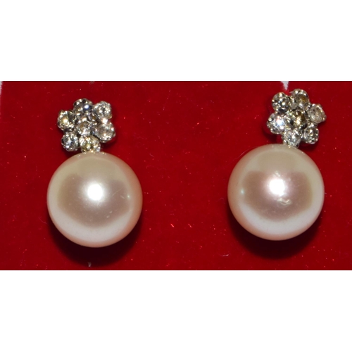 390 - Pair 18ct white gold Diamond cluster and a large natural cultured Pearl earrings 