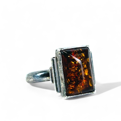 150 - A ladies silver & amber ring.Size - S