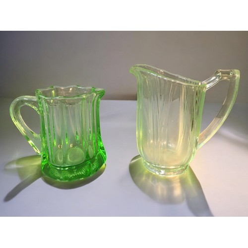 93 - Uranium Glass items and an Art Deco Josef Inwald Dolphin. Largest 16cm x 19cm 3 x Jugs and a Vase.