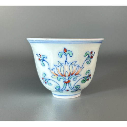 86 - A Chinese Doucai porcelain cup. Painted Lotus pattern. Marked to base. Together with a Sang de Boeuf... 