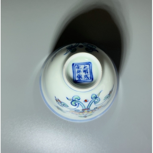 86 - A Chinese Doucai porcelain cup. Painted Lotus pattern. Marked to base. Together with a Sang de Boeuf... 