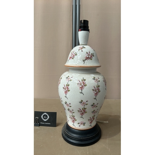 150 - Chinese Porcelain table lamp with floral motif, featuring a crackle glaze finish, mounted on a black... 