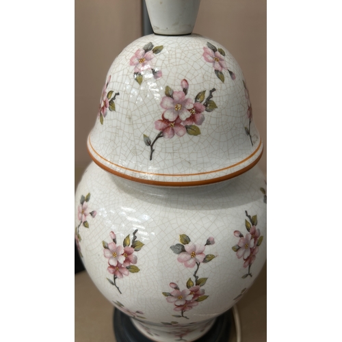 150 - Chinese Porcelain table lamp with floral motif, featuring a crackle glaze finish, mounted on a black... 