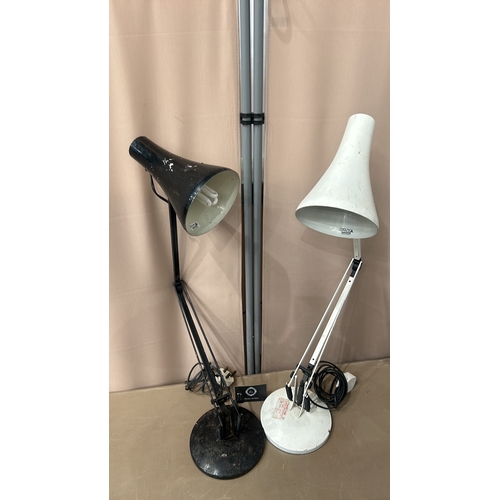 151 - Set of two vintage ANGLEPOSE adjustable desk lamps with metal construction; one black and one white.