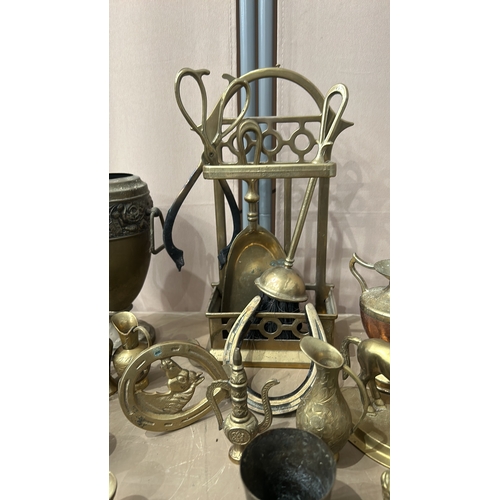 154 - Collection of vintage brass items, including decorative vases, figurines, miniature chairs, and a se... 