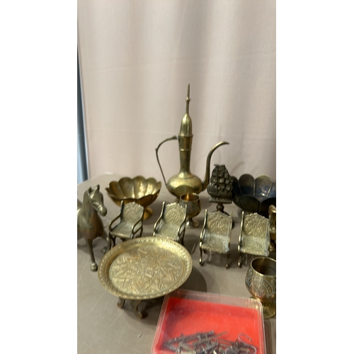 154 - Collection of vintage brass items, including decorative vases, figurines, miniature chairs, and a se... 