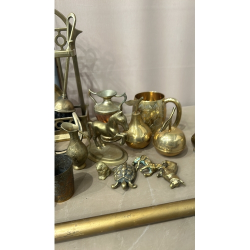 154 - Collection of vintage brass items, including decorative vases, figurines, miniature chairs, and a se... 