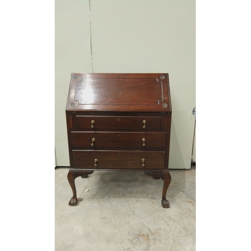 146 - Antique mahogany fold-top desk with brass hardware, claw-foot legs, and internal compartments.