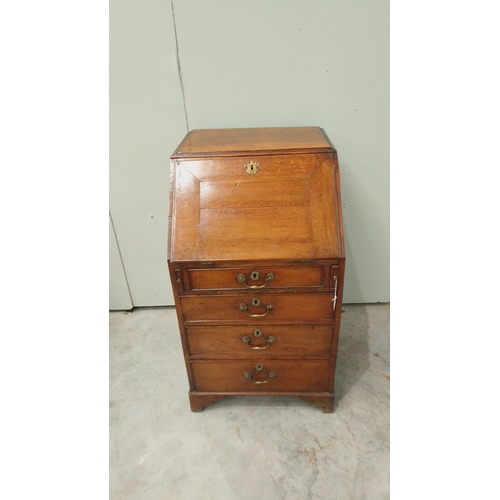 148 - Antique oak bureau from the Edwardian period, featuring drop front, multiple drawers with brass hand... 