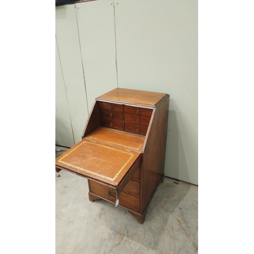 148 - Antique oak bureau from the Edwardian period, featuring drop front, multiple drawers with brass hand... 