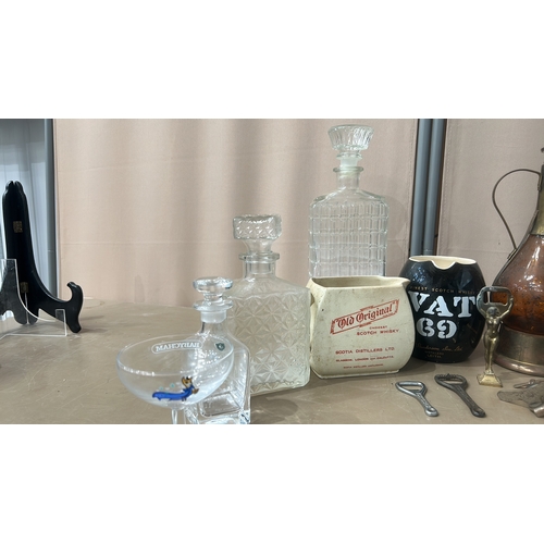 162 - Mixed lot featuring vintage glass bottles, ceramic steins, pewter cup, crystal decanters, and cerami... 