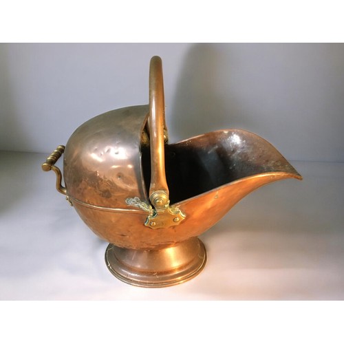 64 - 19th Century Helmet Copper Coal Scuttle, and a Brass and Cast Iron Stick Stand