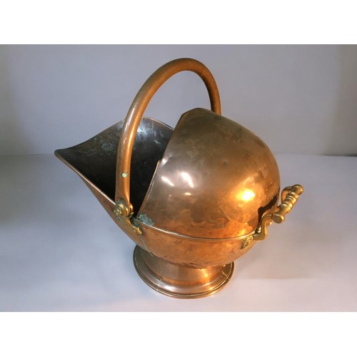 64 - 19th Century Helmet Copper Coal Scuttle, and a Brass and Cast Iron Stick Stand