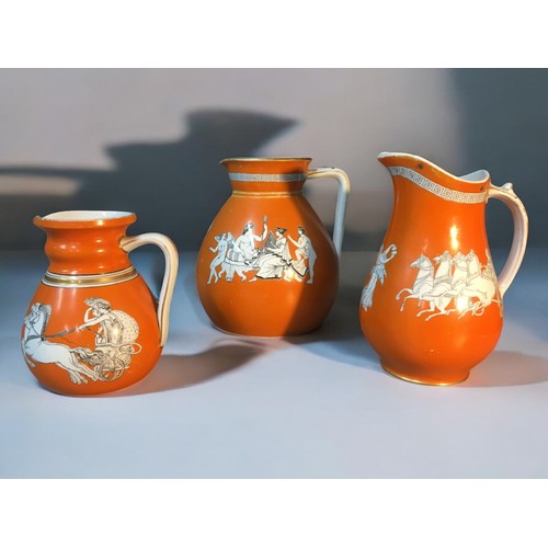 154 - Three 19th century 'Neo Classical' orange ground porcelain jugs. Including John Meir & sons and ... 