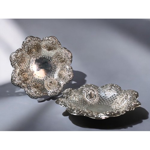 561 - A pair of  Victorian sterling silver Bonbon dishes. James Dixon & sons. Sheffield, 1897 & 18... 