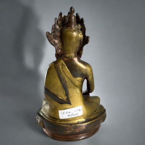 48 - A Chinese /  Nepalese gilt bronze of Shakyamuni Buddha.Height - 20cm