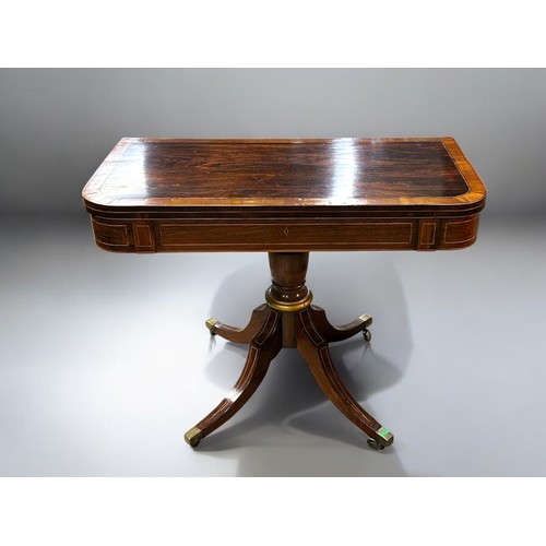 273 - A Regency period Mahogany inlaid folding tea table.Swivel and fold over action. Turned column on rai... 