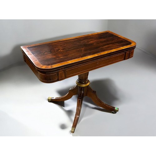 273 - A Regency period Mahogany inlaid folding tea table.Swivel and fold over action. Turned column on rai... 