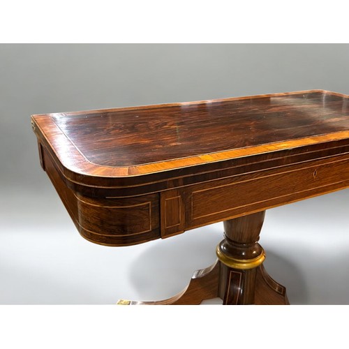 273 - A Regency period Mahogany inlaid folding tea table.Swivel and fold over action. Turned column on rai... 