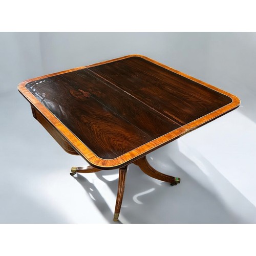 273 - A Regency period Mahogany inlaid folding tea table.Swivel and fold over action. Turned column on rai... 