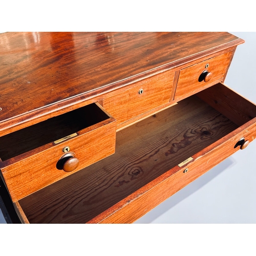 282 - A 19th Century Mahogany Chest of Drawers.Three short drawers over three long. Raised on bracket feet... 