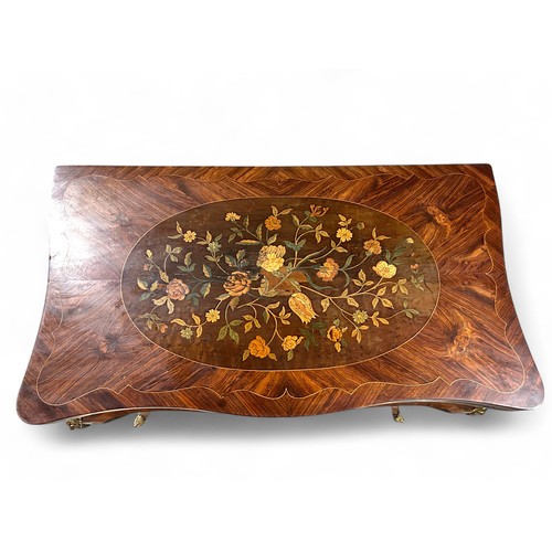 283 - A 19th century French Ormolu mounted Kingswood games table. Marquetry inlaid with foliate design and... 