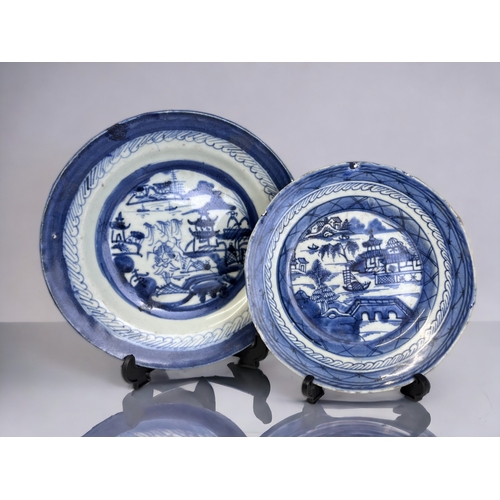 100 - TWO 19TH CENTURY CHINESE PORCELAIN BLUE & WHITE PLATES.
Qing dynasty. 
Painted seaside fishing villa... 