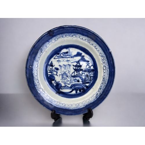 100 - TWO 19TH CENTURY CHINESE PORCELAIN BLUE & WHITE PLATES.
Qing dynasty. 
Painted seaside fishing villa... 