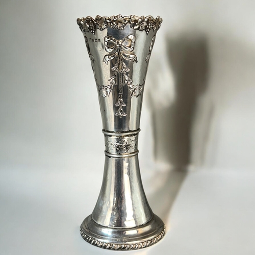 562 - A large silver spill vase.Bow & foliate design.