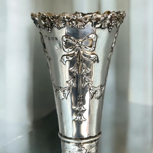 562 - A large silver spill vase.Bow & foliate design.