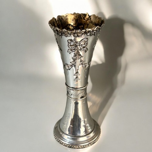 562 - A large silver spill vase.Bow & foliate design.