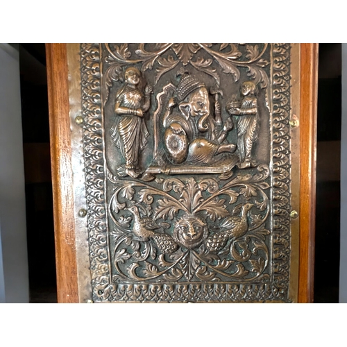 599 - A fine pair of Indian Bas relief decorated copper plaques.Raj period,19th century.Mounted on wood. F... 