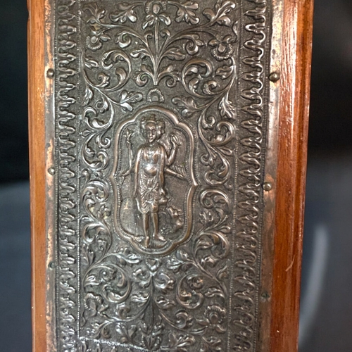 599 - A fine pair of Indian Bas relief decorated copper plaques.Raj period,19th century.Mounted on wood. F... 