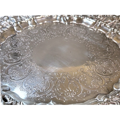 586 - George IV sterling silver tray.London, 1827 hallmarks.By William Eley II.Elaborately decorated with ... 