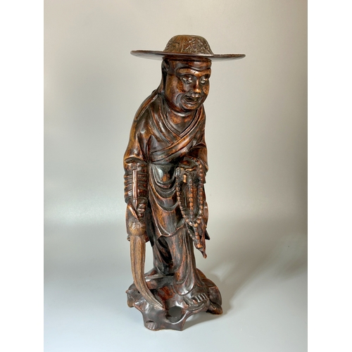 90 - A collection of Oriental wood carvings. Tallest - 28cm