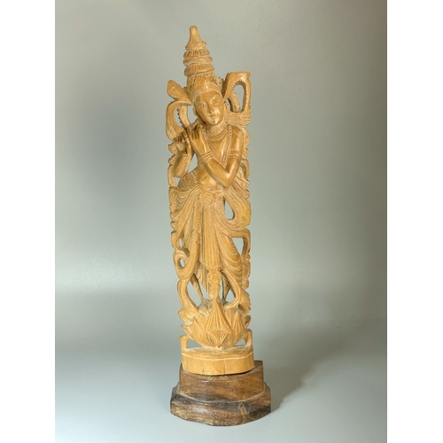 90 - A collection of Oriental wood carvings. Tallest - 28cm