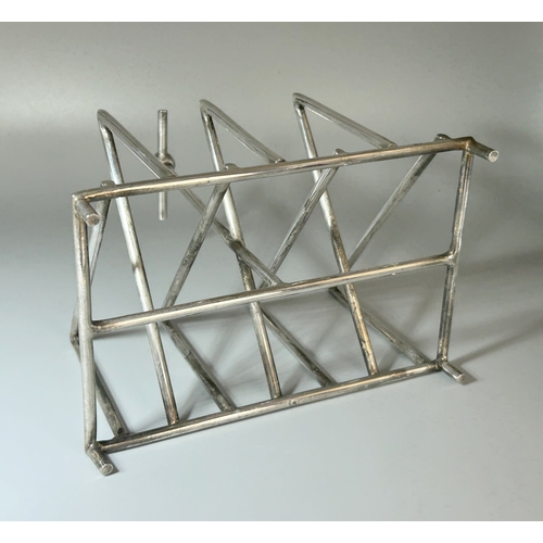 573 - A Christopher Dresser design silver plate toast rack.Tall T-Bar handle.Unmarked.16 x 15 x 10.5cm... 